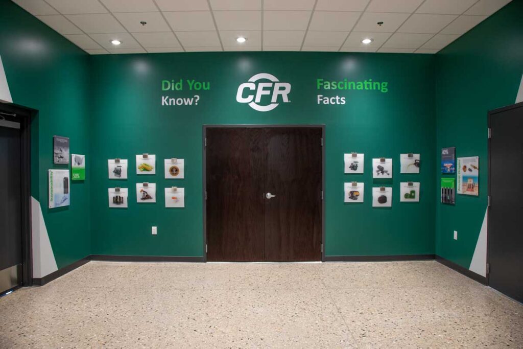 CFR History Wall 2 CFR History Wall displaying various graphics and images on a large, green wall.