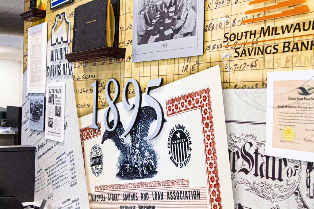 PyraMax Bank History Wall 2 Close-up view of PyraMax Bank's history wall, displaying "1895" and various other graphics.