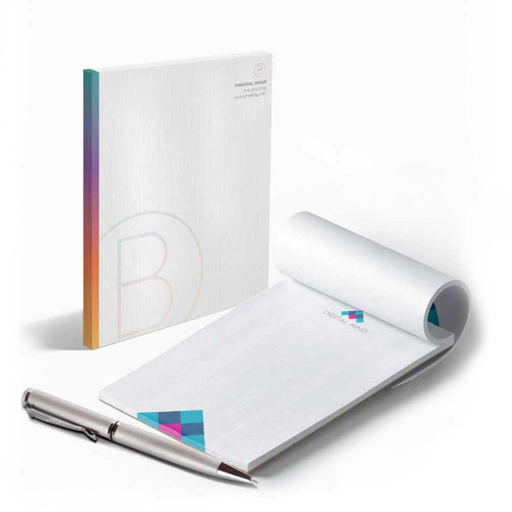 Business Printing 11 Two examples of white stationary with rainbow embellishments and a silver, metallic pen.