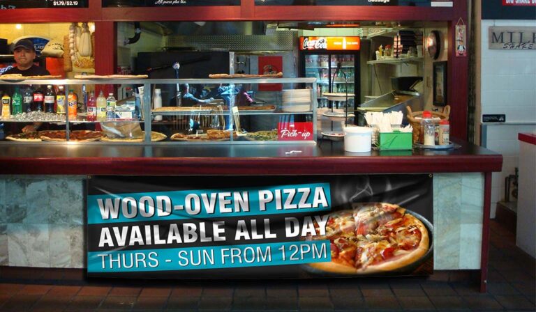 Restaurant with indoor banner underneath counter