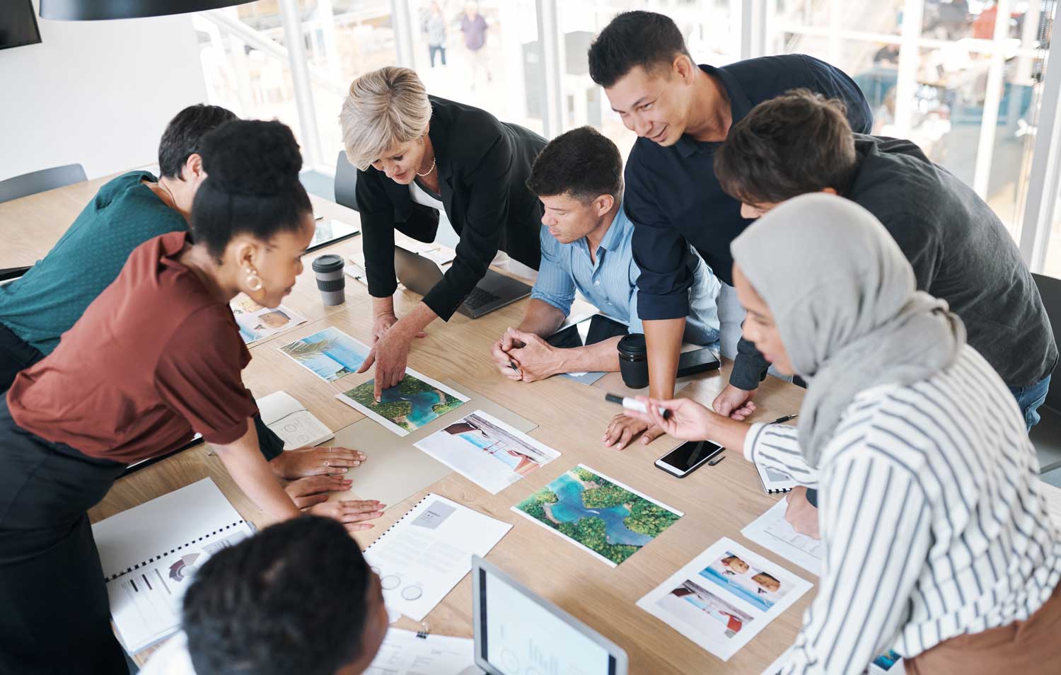 P-R-A-C-T-I-C-E Core Values with BPI Color: Respect 5 8 teammates working around a project in an office setting.