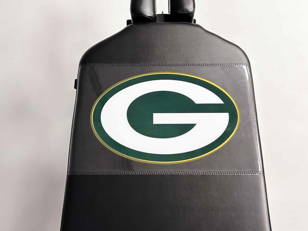 Thuli Tables athletic treatment table featuring a custom Green Bay Packers “G” logo on black upholstery.
