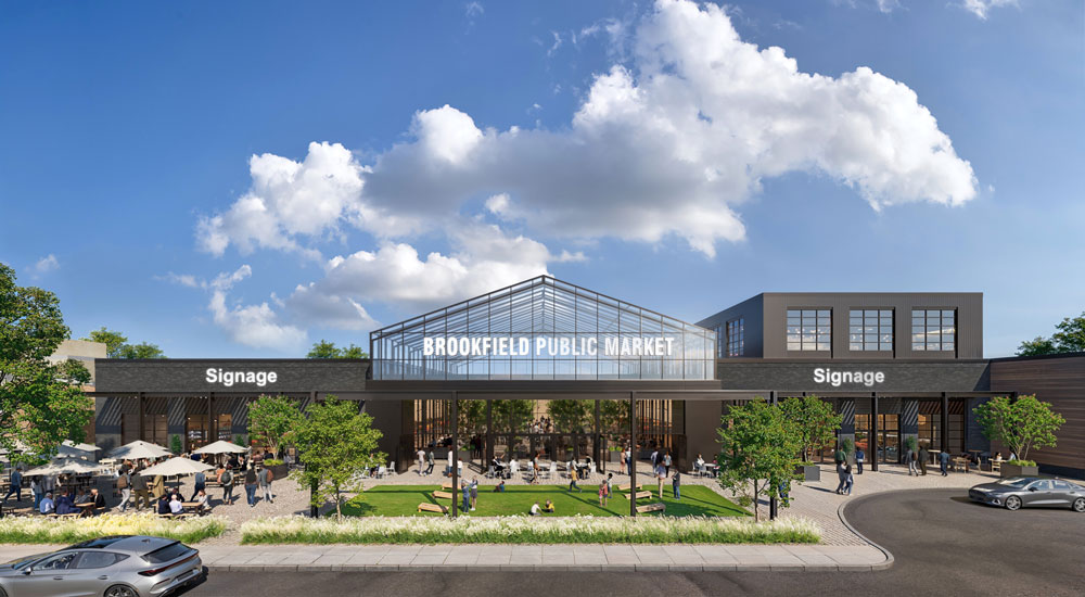 Brookfield Public Market exterior view with modern glass architecture, visible signage, outdoor seating, greenery, and people enjoying the open-air space.